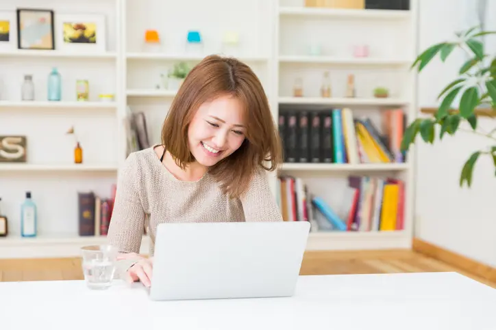 Beautiful young asian woman using laptop