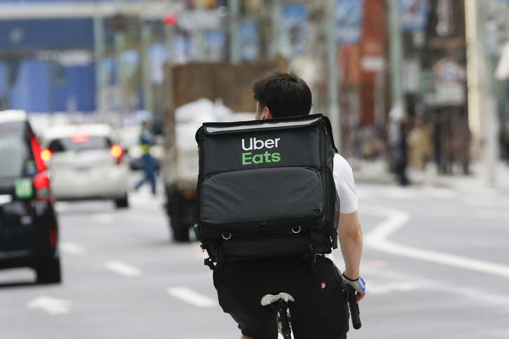 Tokyo, Japan, March 28, 2020 - An Uber eats driver is seen at the Ginza shopping district.