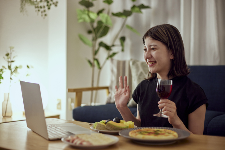 A young Japanese woman enjoying alcohol alone at home