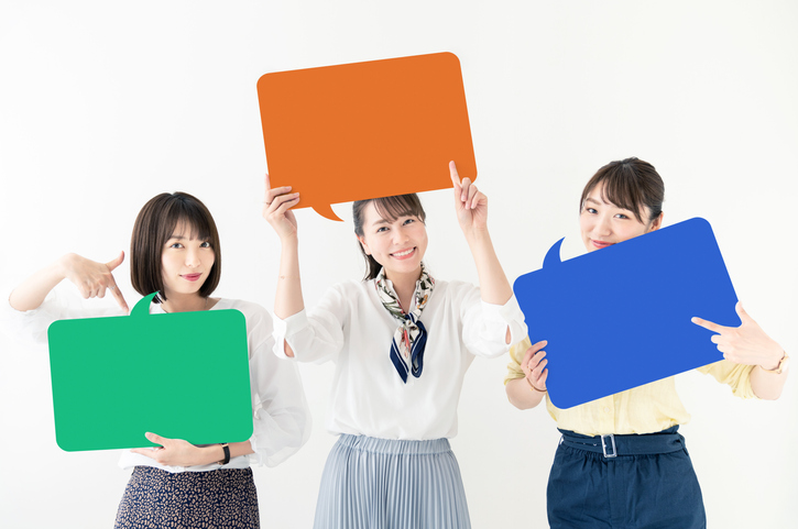 Group of asian girl showing colorful sign boards.