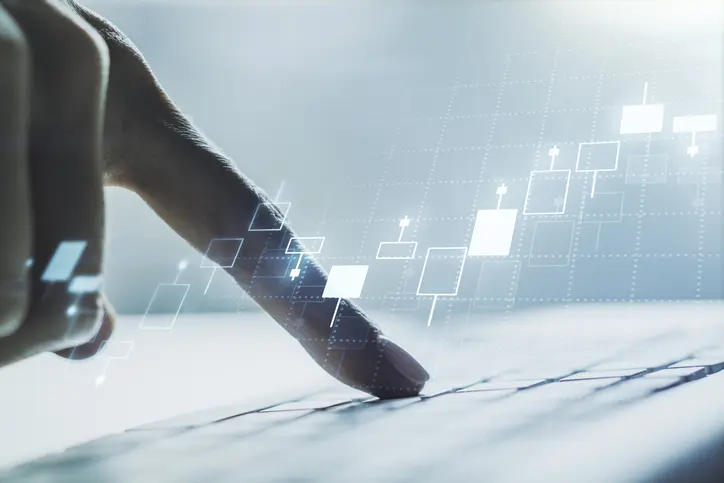 Abstract creative financial graph with hand typing on laptop on background, forex and investment concept. Multiexposure